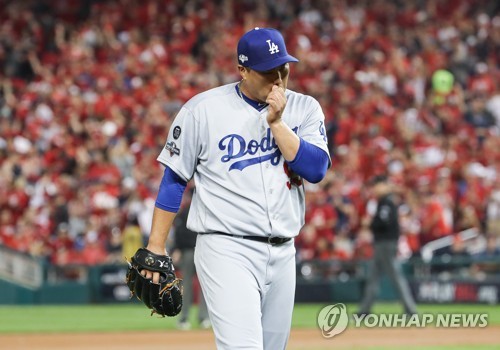 Los Angeles Dodgers starting pitcher Hyun-Jin Ryu throws to a Washington  Nationals batter during the first inning in Game 3 of a baseball National  League Division Series on Sunday, Oct. 6, 2019