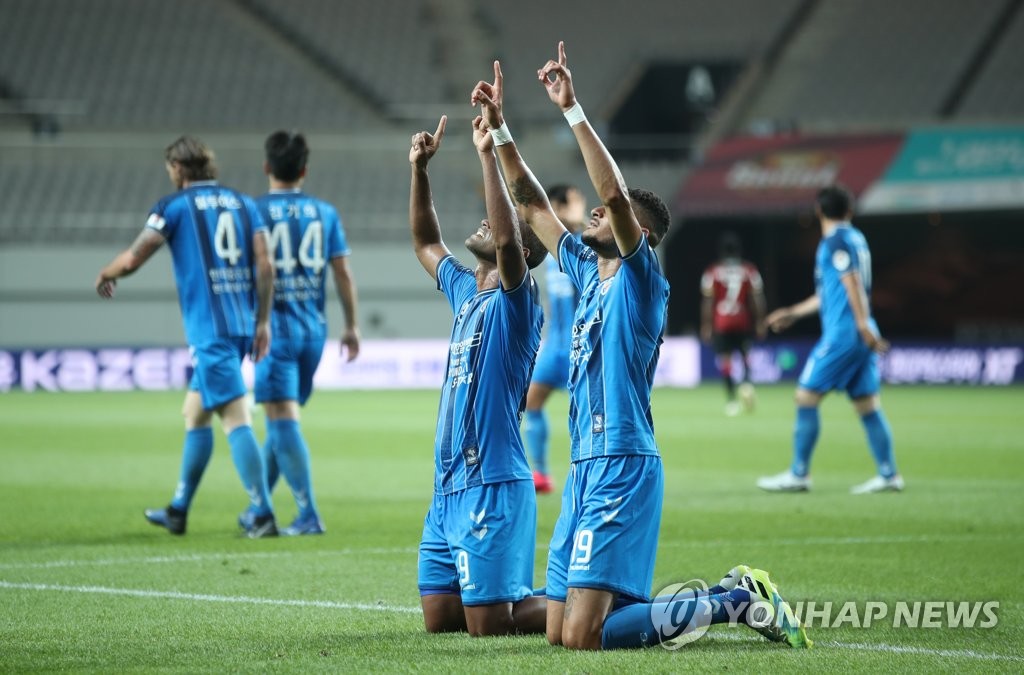 Junior Negrao (L) and Bjorn Johnsen of Ulsah Hyundai FC celebrate Junior Negrao's goal against FC Seoul during their K League 1 match at Seoul World Cup Stadium in Seoul on June 20, 2020. (Yonhap)