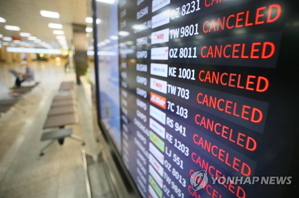An electronic board at Jeju International Airport shows flights that were canceled due to Typhoon Bavi on Aug. 26, 2020. (Yonhap)