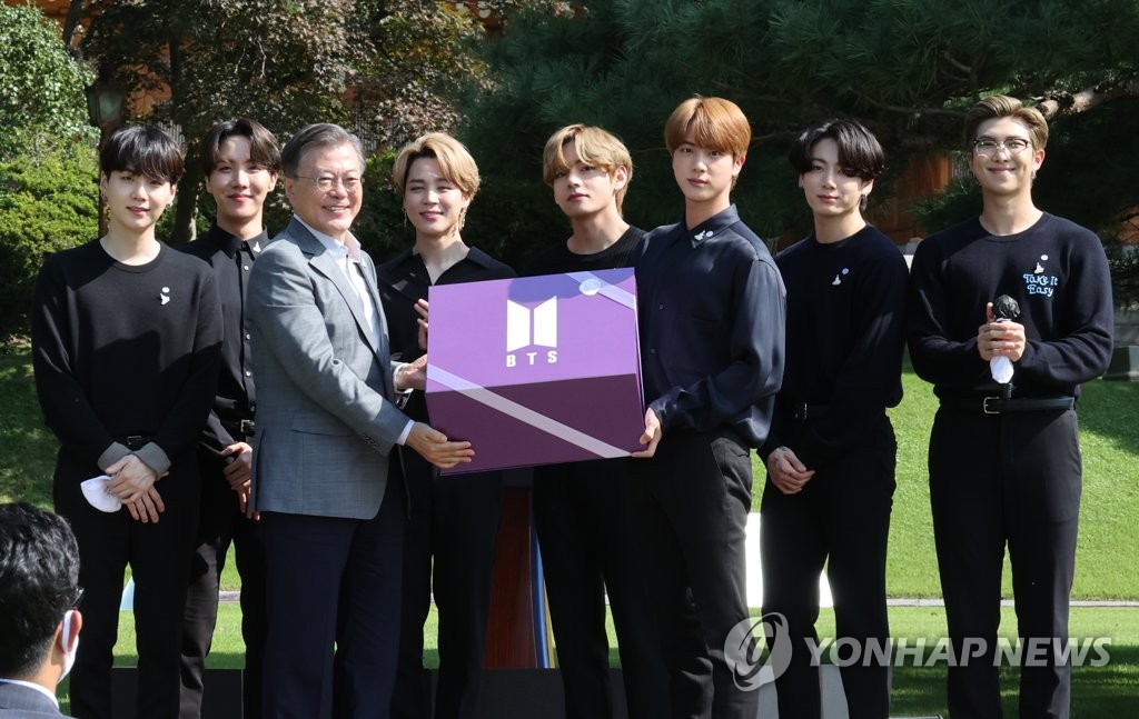 BTS members hand over the "Year 2039 Gift" to President Moon Jae-in during the 1st Youth Day event at Cheong Wa Dae in Seoul on Sept. 19, 2020. (Yonhap)