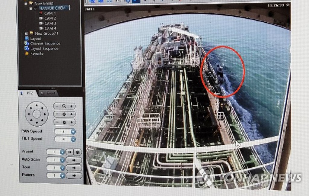 This closed-circuit TV image shows South Korean oil tanker MT Hankuk Chemi arriving in an Iranian port after it was seized by Iranian troops on Jan. 4, 2021. An Iranian speedboat is seen in the red circle. (Yonhap)