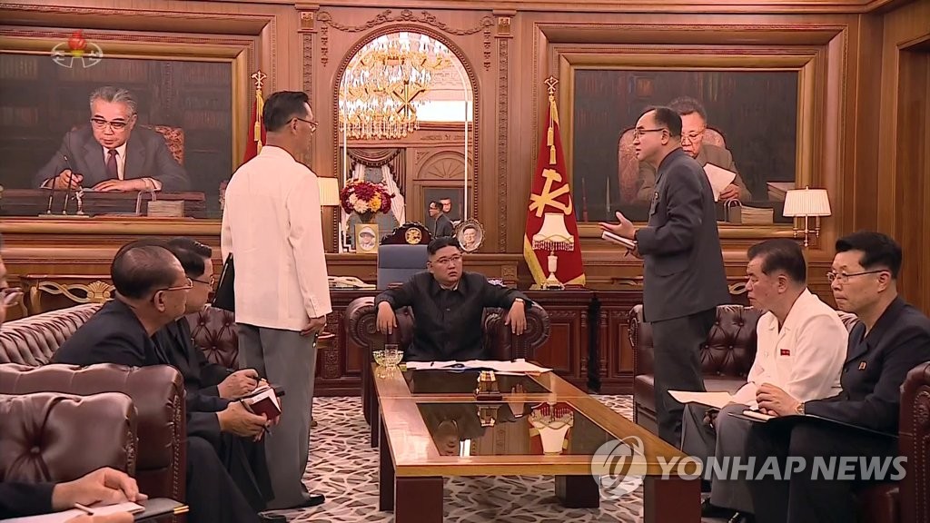 North Korean leader Kim Jong-un (C) presides over a meeting of senior officials of the central committee and provincial party committees of the ruling Workers' Party in Pyongyang on June 7, 2021, in this photo captured from the North's Korean Central Television the next day. (For Use Only in the Republic of Korea. No Redistribution) (Yonhap)