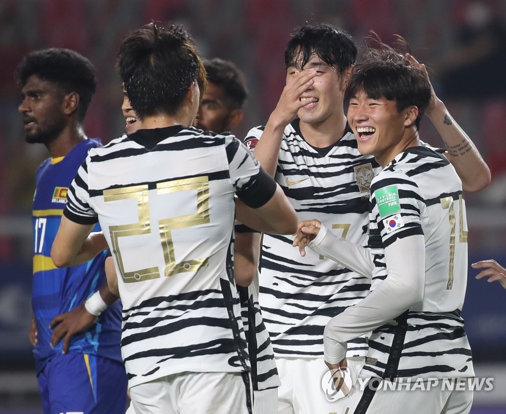 Jeong Sang-bin of South Korea (R) is congratulated by teammates after scoring a goal against Sri Lanka during the teams' Group H match in the second round of the Asian qualification for the 2022 FIFA World Cup at Goyang Stadium in Goyang, Gyeonggi Province, on June 9, 2021. (Yonhap)