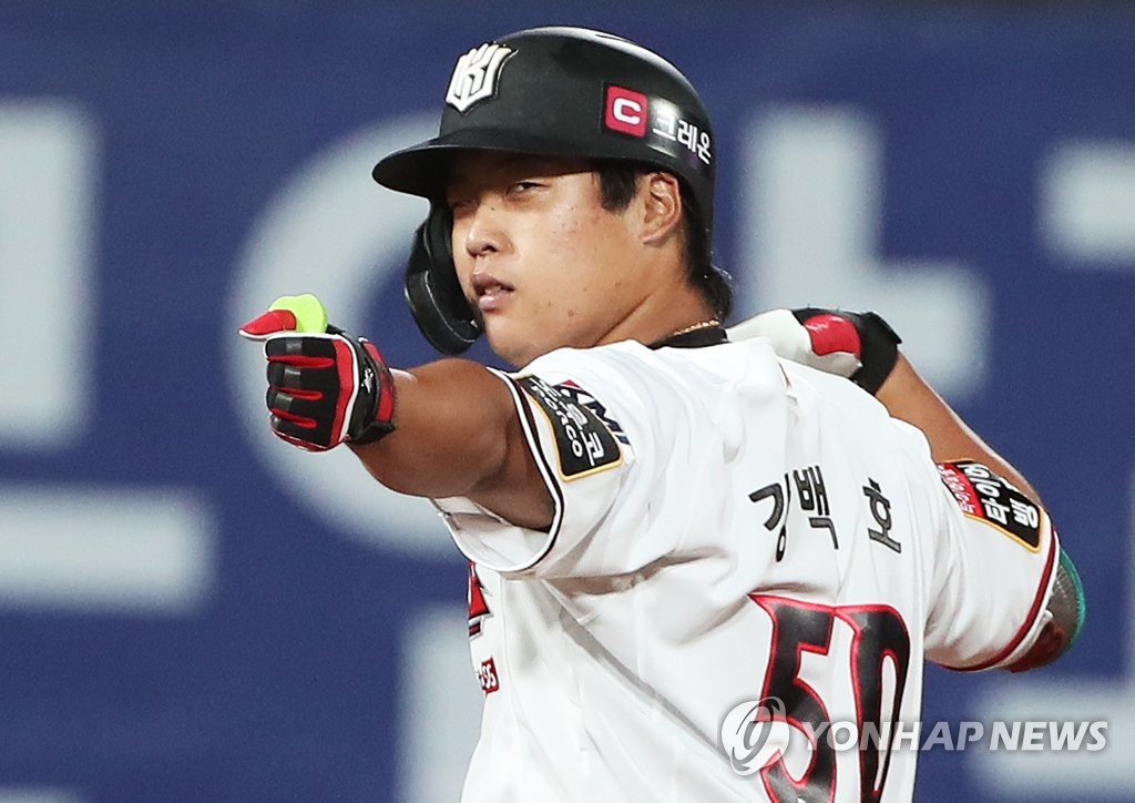 In this file photo from July 4, 2021, Kang Baek-ho of the KT Wiz celebrates his two-run double against the Kiwoom Heroes in the bottom of the seventh inning of a Korea Baseball Organization regular season game at KT Wiz Park in Suwon, 45 kilometers south of Seoul. (Yonhap)