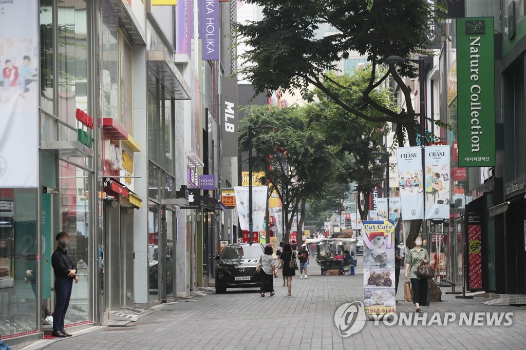 This photo, taken July 11, 2021, shows an almost empty street in Seoul's shopping district of Myeongdong, a day before South Korea plans to enforce the toughest-ever virus curbs in the greater capital area over spiking virus cases. (Yonhap)