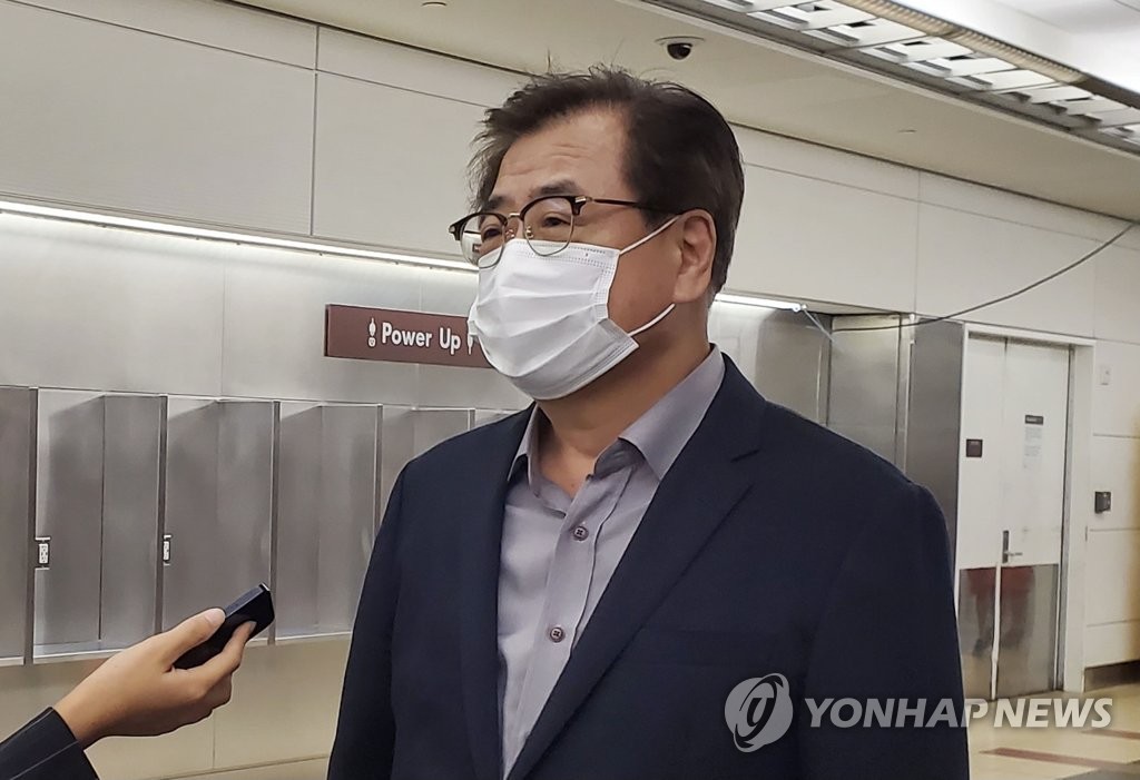 National Security Adviser Suh Hoon speaks to reporters upon arrival at Ronald Reagan Washington National Airport in Arlington on Oct. 11, 2021. (Yonhap)