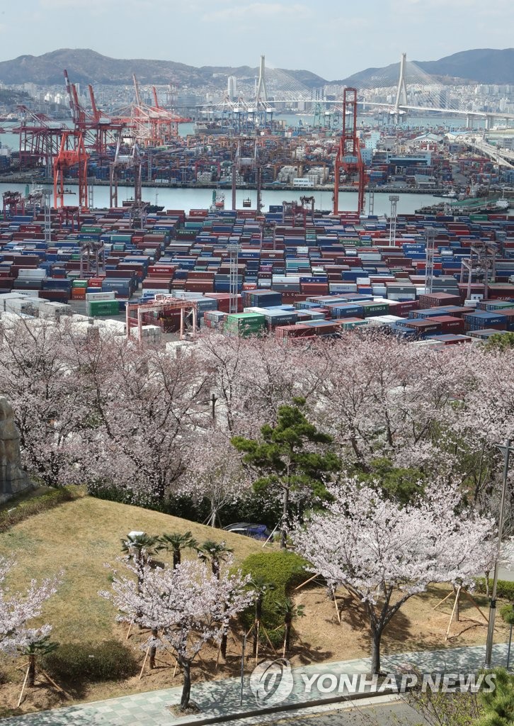 Containers for exports and imports are stacked at a pier in South Korea's largest port city of Busan on April 1, 2022. South Korea's exports jumped 18.2 percent in March from a year earlier to reach an all-time monthly high on the back of brisk demand for chips and petroleum products, data showed. But high global energy prices also pushed up the country's imports to a record high last month, leading the country to post a trade deficit, according to the data compiled by the Ministry of Trade, Industry and Energy. (Yonhap)