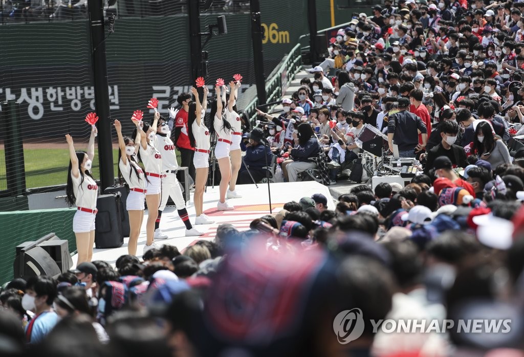 In this file photo from April 10, 2022, cheerleaders for the home team Lotte Giants perform on the stage during a Korea Baseball Organization regular season game against the Doosan Bears at Sajik Stadium in Busan, some 450 kilometers southeast of Seoul, on April 10, 2022. (Yonhap)
