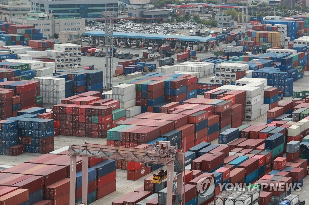 This file photo taken May 11, 2022, shows stacks of containers at a port in South Korea's southeastern city of Busan. (Yonhap)