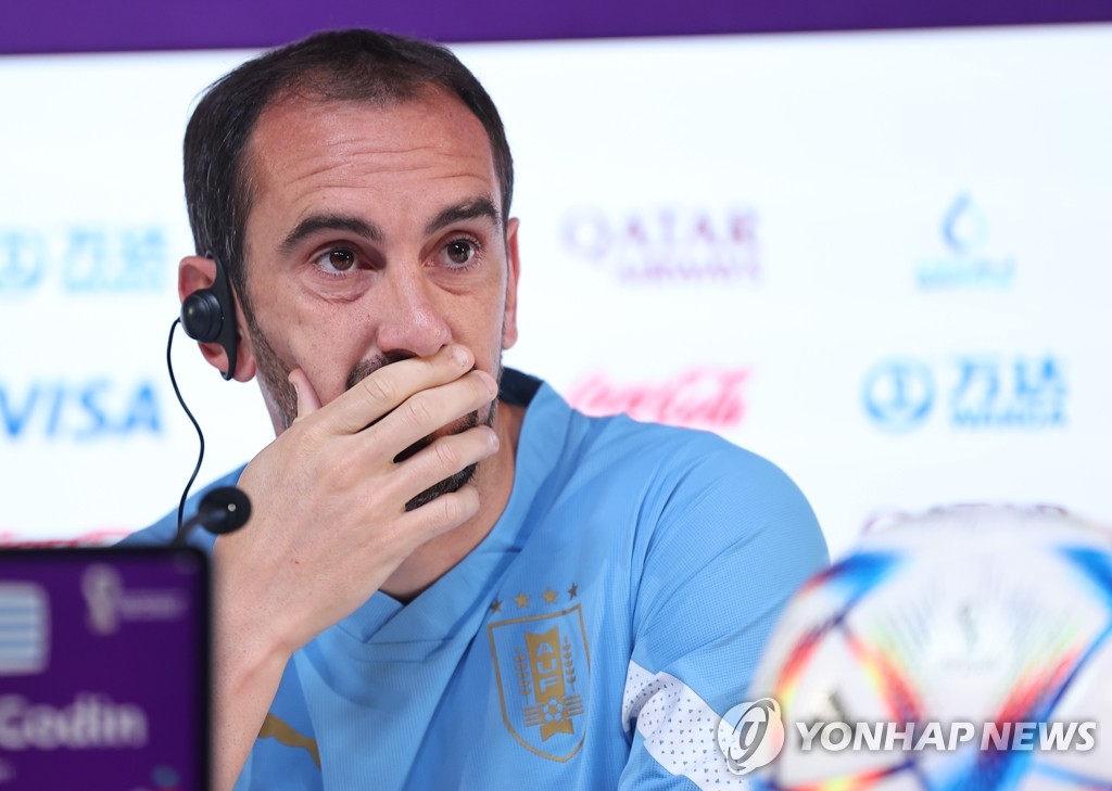Uruguay captain Diego Godin speaks at a press conference ahead of Group H match against South Korea at the FIFA World Cup at the Main Media Centre in Al Rayyan, west of Doha, on Nov. 23, 2022. (Yonhap)