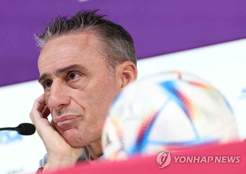 South Korea head coach Paulo Bento listens to a question at a press conference ahead of his team's Group H match against Ghana at the FIFA World Cup at the Main Media Centre in Al Rayyan, west of Doha, on Nov. 27, 2022. (Yonhap)