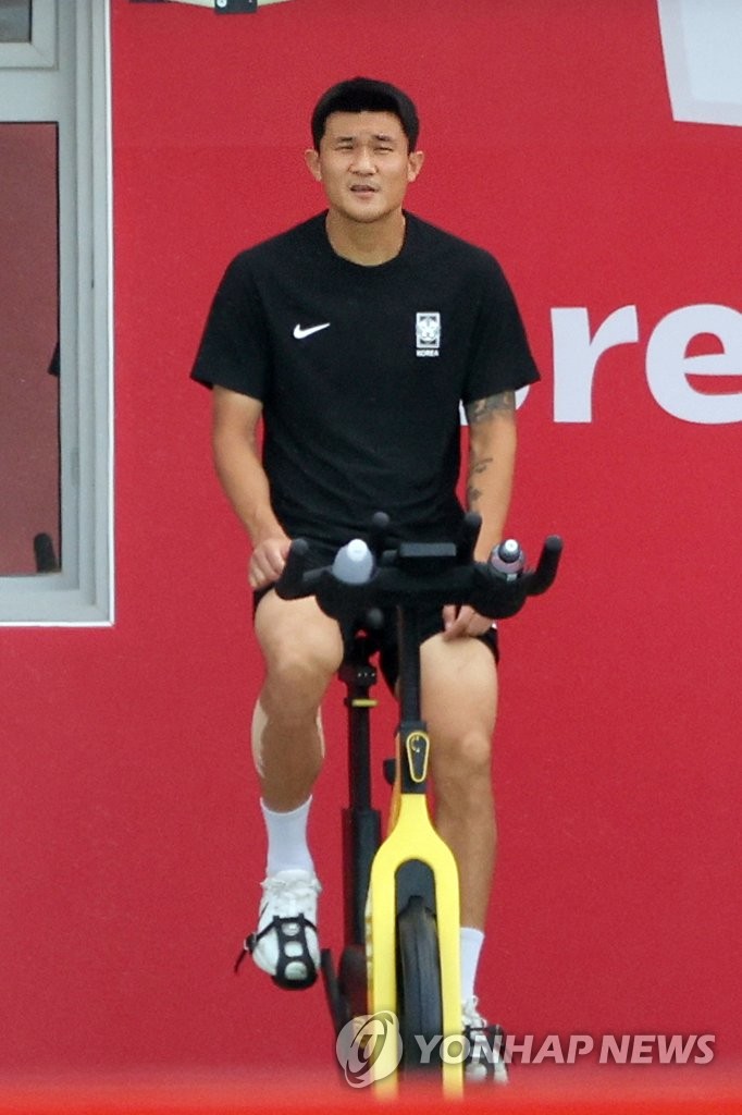 South Korean defender Kim Min-jae rides a stationary bicycle during a training session for the FIFA World Cup at Al Egla Training Site in Doha on Dec. 1, 2022. (Yonhap)