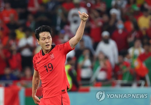 Kim Young-gwon cheers after scoring equalizer