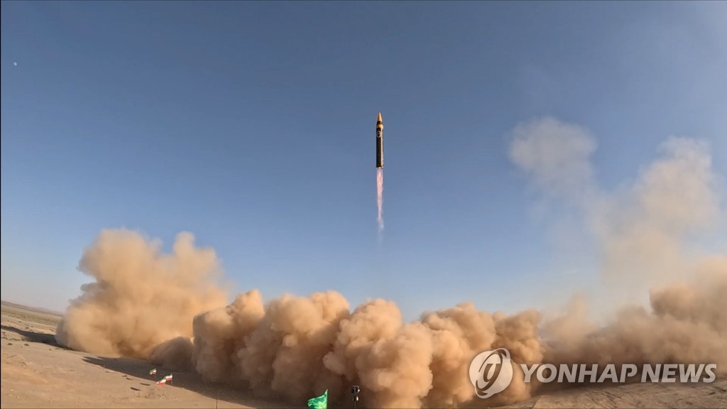 This photo, provided by EPA on May 25, 2023, shows Iran unveiling its new medium-range ballistic missile Kheibar that Tehran claims is capable of carrying a 1.5-ton warhead and hitting a target some 2,000 kilometers away. (PHOTO NOT FOR SALE) (Yonhap)