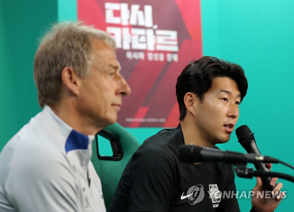 In this file photo from June 19, 2023, South Korean captain Son Heung-min (R) speaks at a press conference before a friendly match against El Salvador, alongside his head coach, Jurgen Klinsmann, at Daejeon World Cup Stadium in the central city of Daejeon. (Yonhap)
