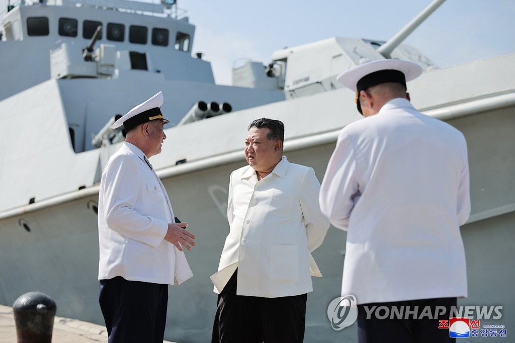 This photo, carried by North Korea's official Korean Central News Agency on Aug. 21, 2023, shows North Korean leader Kim Jong-un (C) visiting a navy unit and overseeing a test launch of cruise missiles. (For Use Only in the Republic of Korea. No Redistribution) (Yonhap)