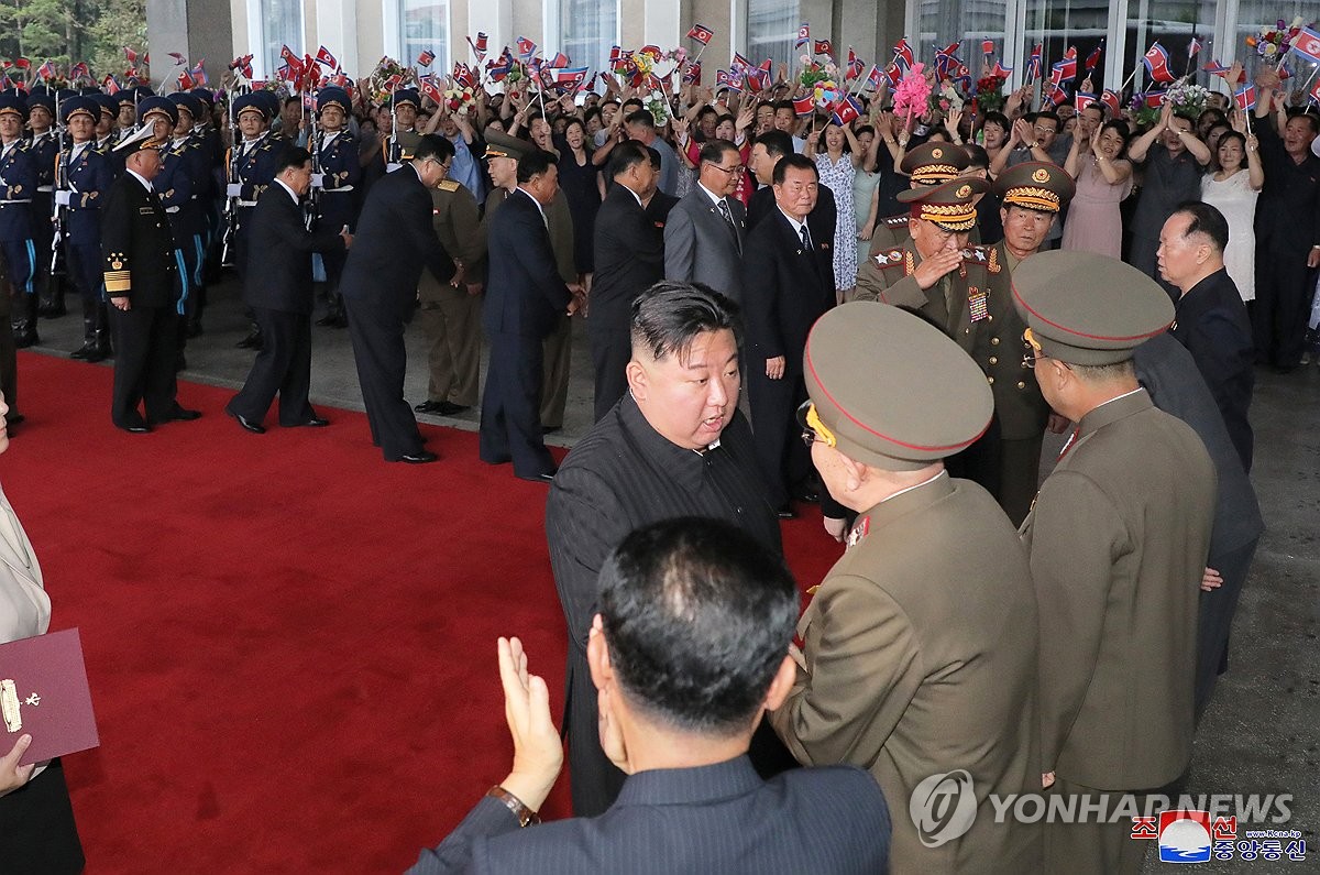 This photo, carried by North Korea's official Korean Central News Agency on Sept. 12, 2023, shows the North's leader Kim Jong-un (C) talking to officials ahead of a trip to Russia. (For Use Only in the Republic of Korea. No Redistribution) (Yonhap)