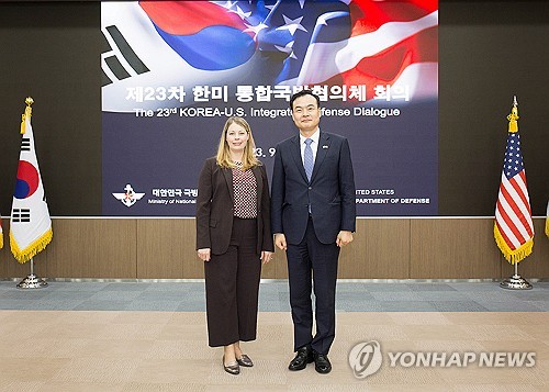 Deputy Defense Minister for Policy Heo Tae-keun (R) and Cara Allison Marshall, acting deputy assistant secretary of defense for East Asia, pose for a photo as they attend the Korea-U.S. Integrated Defense Dialogue at Seoul's defense ministry compound in central Seoul on Sept. 18, 2023, in this photo provided by the ministry. (PHOTO NOT FOR SALE) (Yonhap)