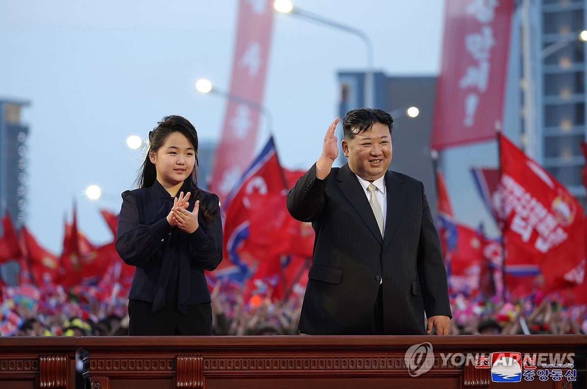 North Korean leader Kim Jong-un (R) attends a ceremony alongside his daughter, Ju-ae, to mark the completion of a new street in Pyongyang on May 14, 2024, in this photo carried by the North's official Korean Central News Agency the next day. (For Use Only in the Republic of Korea. No Redistribution) (Yonhap)