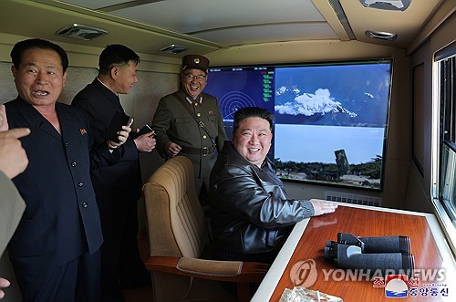 North Korean leader Kim Jong-un (R) oversees a test-firing of a tactical ballistic missile equipped with a new "autonomous" navigation system on May 17, 2024, in this photo released by the North's Korean Central News Agency the next day. (For Use Only in the Republic of Korea. No Redistribution) (Yonhap)