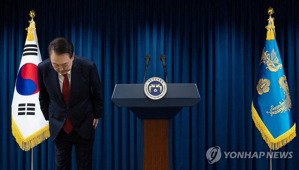 President Yoon Suk Yeol bows ahead of a public address at the presidential office in Seoul on Dec. 7, 2024, to apologize for his short-lived martial law declaration, in this photo provided by his office. (PHOTO NOT FOR SALE) (Yonhap)